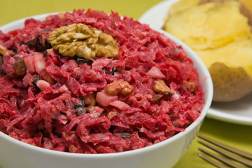 Salad with beets, dried plums, nuts