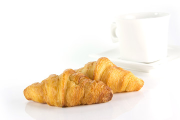 fresh and tasty croissant on white background