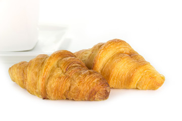 Fresh and tasty croissant on white background