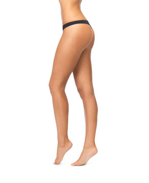 female legs in black bikini panties