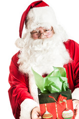 Santa clause holding a gift