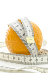 Fresh orange with measuring tape