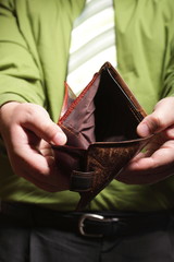 Empty wallet in male hands - poor economy