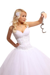 Fototapeta na wymiar bride in handcuffs. beautiful blonde thinking isolated
