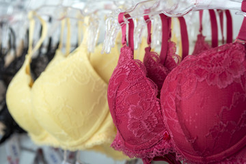 Yellow and red bra - obrazy, fototapety, plakaty