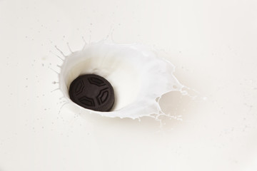 Cookie and splashing in milk.