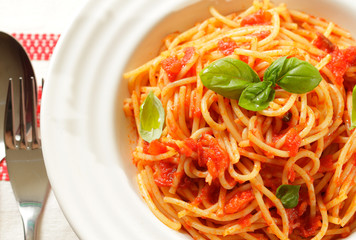 Spaghetti with tomato sauce and basil