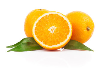 Fresh oranges fruit with green leaves, isolated on white