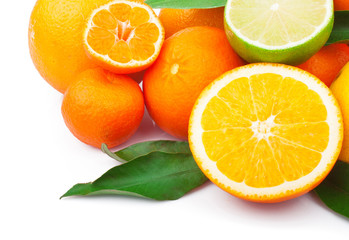 Fresh citrus fruits whole and half with green leaves, food