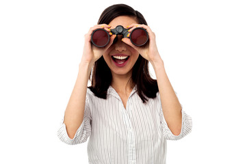 Businesswoman enjoying view through binoculars