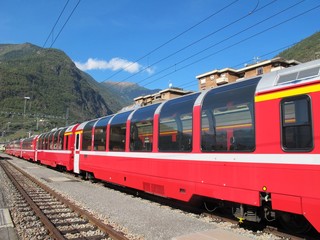 red train around the beautiful Swiss mountains 1