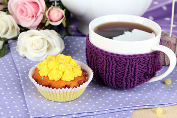 Delicious beautiful  cupcake on dining table close-up