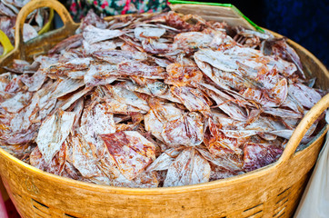 Sea food at market. Selling dry calamari in Thailand