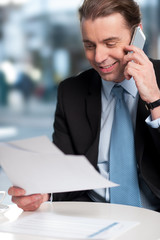 Businessman communicatng on phone