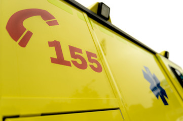 Emergency phone number sign on ambulance car