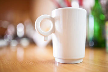 Obraz na płótnie Canvas Cup of coffee or tea on wooden table, small dof