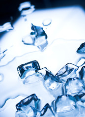 Abstract background with ice cubes over wet glass