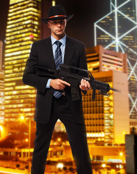 Tall professional killer with a rifel