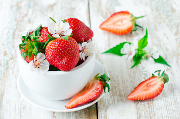 Fresh strawberries in the white bowl
