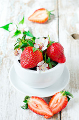 Fresh strawberries in the white bowl
