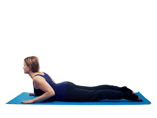 Young woman exercising yoga cobra - isolated