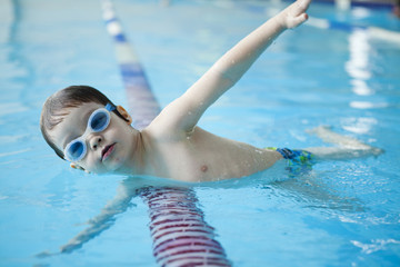 little boy have fun on swimming pool