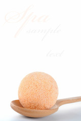 Sea salt poured from wooden spoon