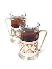 glass of black tea with glass holder isolated on white backgroun