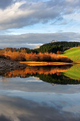 Reflections in Urkulu reservoir at sunset