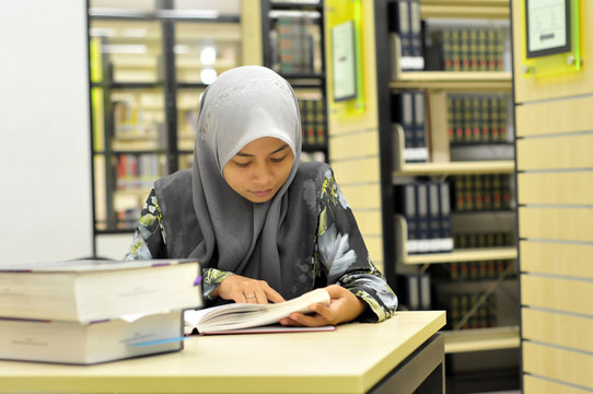 Young Muslim Student Studying In The Library