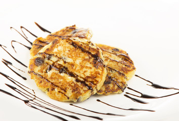 Delightful cheese pancakes on a white background