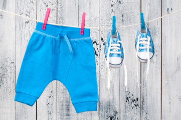 Baby clothes hanging on the clothesline.