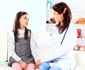 Fototapeta premium The little girl with her mother played in doctors.