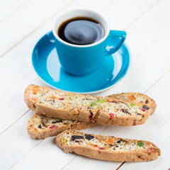 Italian biscotti and a cup of black coffee, close-up
