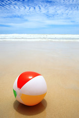 Beautiful beach and beach ball on the sand.
