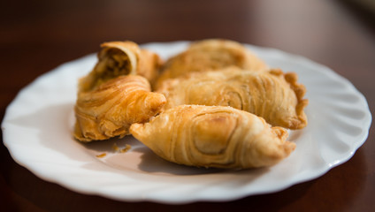 Malaysian favourite snack, curry puff on a white plate