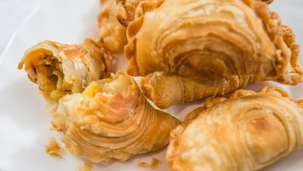 Malaysian favourite snack, curry puff on a white plate