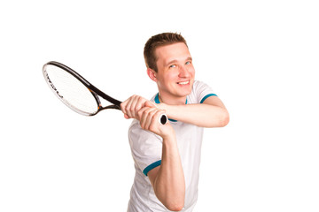 Sportive young man playing tennis