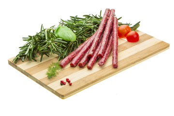 Salami with rosemary, basil and tomato