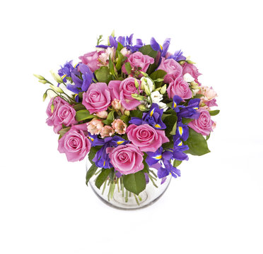 bouquet of pink roses and violet irises isolated on white