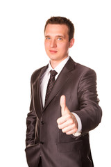 Happy smiling businessman with thumbs up gesture