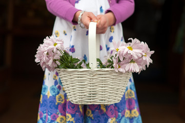 flowergirl with basket of flowers at a wedding