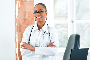 Portrait of young female doctor in clinic