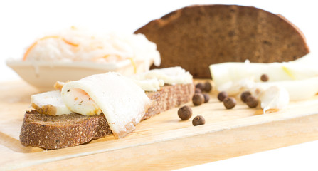 Close-up image of brown bread sandwich with lard