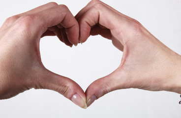 Woman making heart shape with her hands