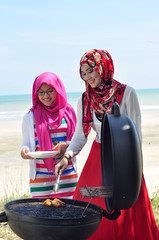 Young muslim women enjoying barbeque