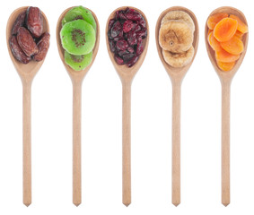 Wooden spoon with dried apricots, figs, dates, kiwi and cranberr