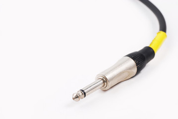 guitar cable audio jack on isolated white background