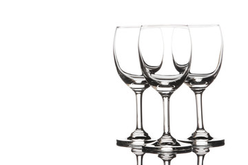 Three empty wine glasses on white background