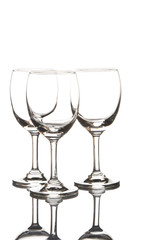 Three empty wine glasses on white background